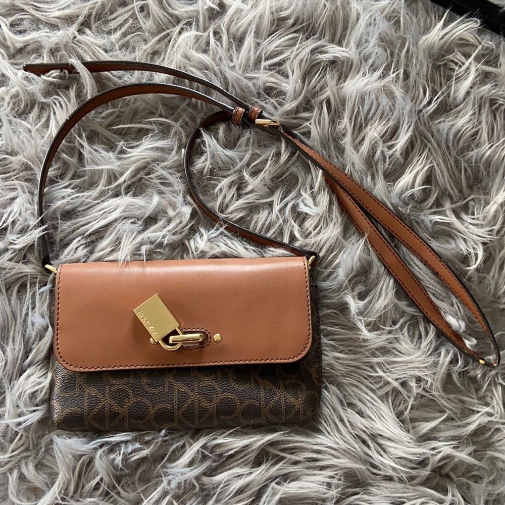 Calvin Klein Leather Crossbody with Adjustable strap and Plenty of Pockets